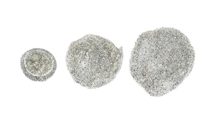 silver drops of nail polish on white background