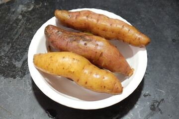 Fresh sweet potato isolated on white background