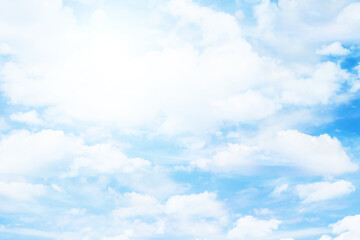 Heaven background. Cloudy sky background. Fluffy clouds on the sky background. Cloudscape view. Bright sunlight on the sky. Middle of the day high sun.