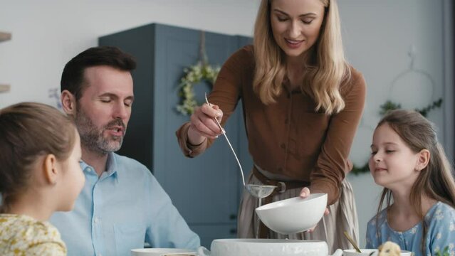 Caucasian family about to start an easter dinner at home. Shot with RED helium camera in 8K.