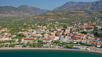 Fototapeta na wymiar Aerial drone photo of picturesque seaside village and beach of Eratini in Fokida prefecture as seen in summer, Greece