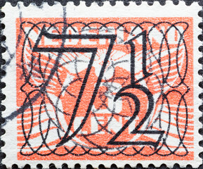 Netherlands - circa 1940: a postage stamp from the Netherlands , showing a Numeral Type 'Guilloche'...