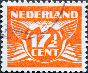 Netherlands - circa 1941: a postage stamp from the Netherlands , showing a stylized graphic. Flying...