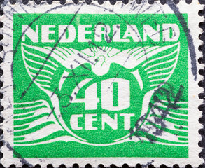 Netherlands - circa 1941: a postage stamp from the Netherlands , showing a stylized graphic. Flying...