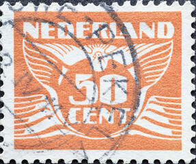 Netherlands - circa 1941: a postage stamp from the Netherlands , showing a stylized graphic. Flying Dove with number 50 cent brown