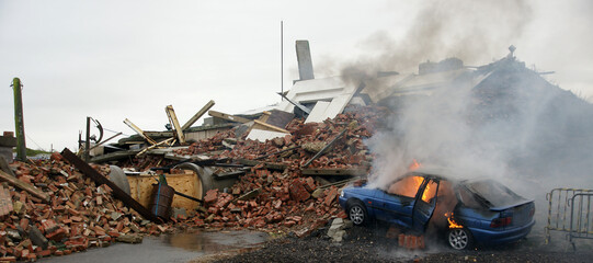 Fototapeta Ukraine war, air strike, on city, urban warfare, street and houses destroyed by blast obraz