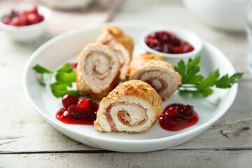 Homemade chicken rolls with cranberry sauce