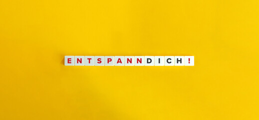 Entspann Dich German Phrase on Letter Tiles on Yellow Background. Minimal Aesthetics.