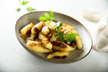 Traditional German potato dumplings with fried onion