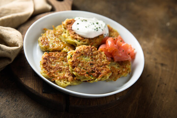Homemade potato pancakes or lakes with salmon