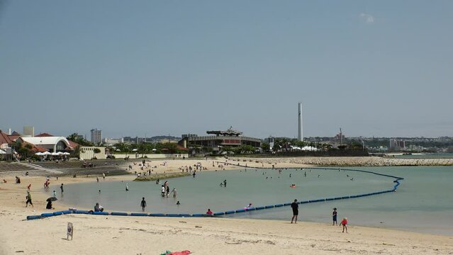 CHATAN-CHO, OKINAWA, JAPAN - AUGUST 2021 : View of Chatan sunset beach (Ocean or sea) in daytime. Summer holiday, vacation and resort concept video.