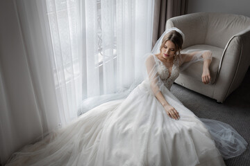 A girl in a wedding dress, a bride with flowers, delicate details.