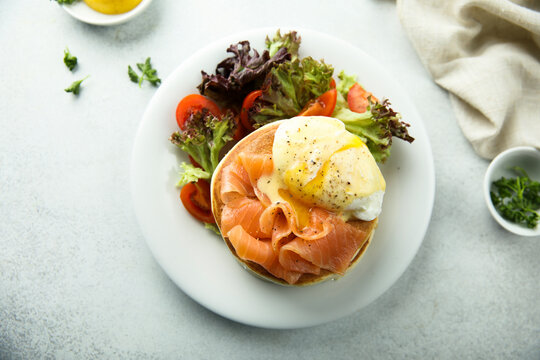 Homemade pancakes with poached egg and salmon