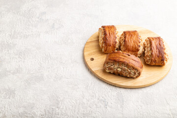 Traditional armenian dessert gata on a gray concrete background and wooden board. side view, copy space.