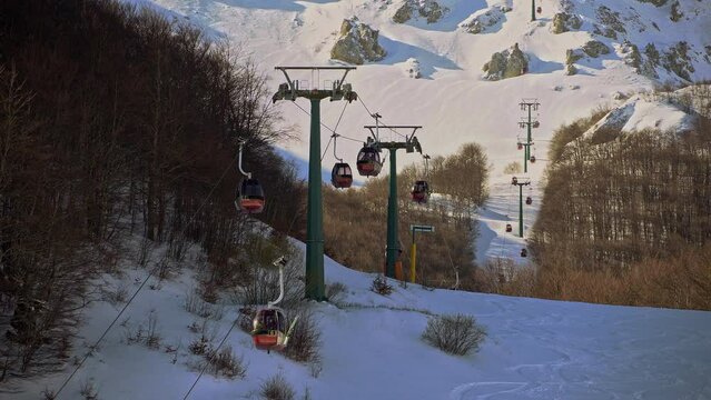 Panoramic cabins transport skiers to the ski slopes. Pallottieri cable car. Aremogna skyresort, Roccaraso, province of L'Aquila, Abruzzo, Italy