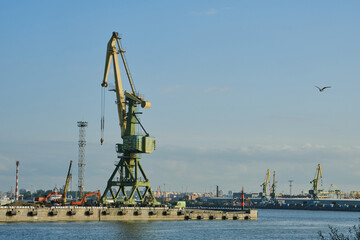 Cargo port cranes in St. Petersburg. Logistic concept. Cargo harbour for unloading and shipment...