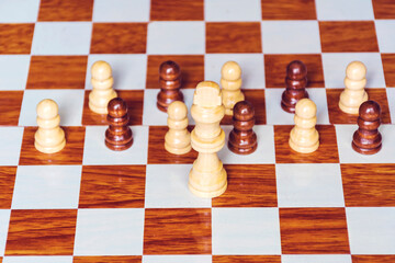 Chess set on a wooden chess board 