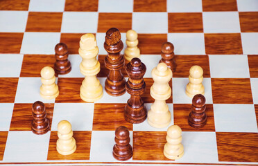 Chess set on a wooden chess board 