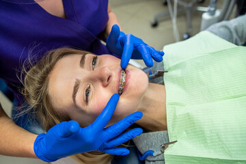 young woman with problem teeth came to the dentist to treat teeth.