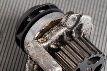 Old leaky car pump. Breakdown of the car pump in the cooling system, macro