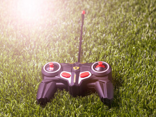 Toy remote control, joystick on the grass