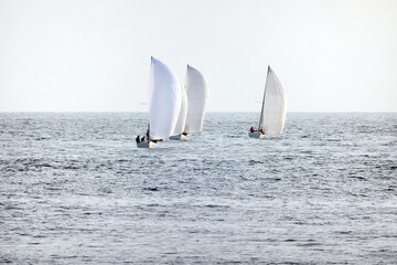 Obraz premium Sailing boats at sea. Sailboat management.