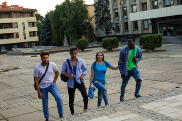 Fototapeta premium The diverse students leave the university after finish lessons