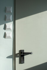 Plastic buttons to switch on the light at the door in the stairwell 