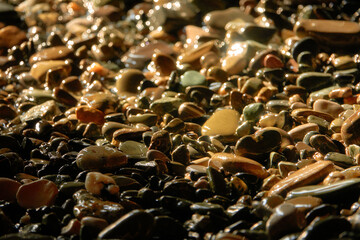 Sea pebbles. Small stones texture. Color stone in abstract background.
