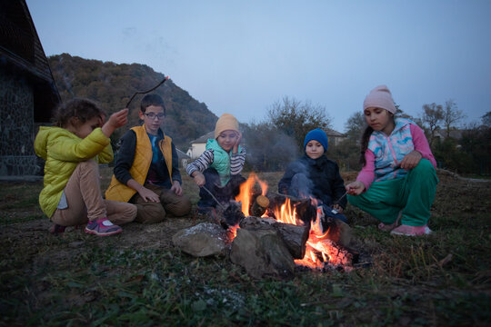 Children in the camp by the fire.