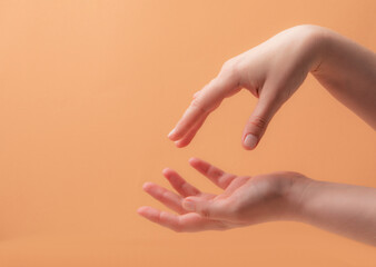 Young female hands applying cream or lotion