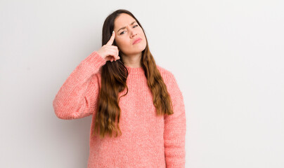 pretty caucasian woman feeling confused and puzzled, showing you are insane, crazy or out of your...