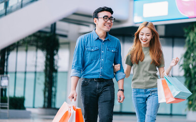 Asian couple shopping at the mall