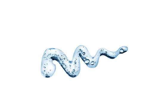 Transparent smear of cream with a gel texture in a zigzag pattern on white background