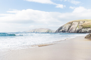 Sunny day on sandy Coumeenoole beach on Slea head, Dingle peninsula in County Kerry, Ireland
