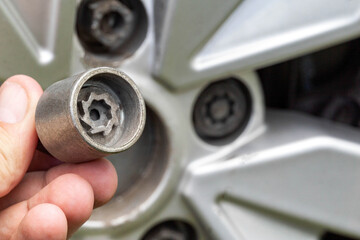 A secret bolt in a car wheel. Anti-theft protection, macro