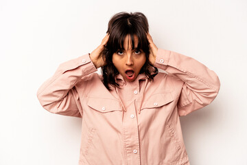 Young hispanic woman isolated on white background screaming, very excited, passionate, satisfied with something.