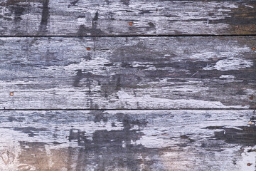 Texture of old wooden door or fence made of planks covered with paint