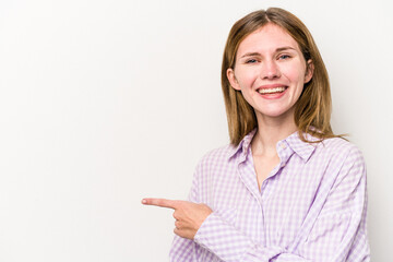 Young russian woman isolated on white background smiling and pointing aside, showing something at blank space.