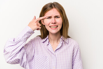 Young russian woman isolated on white background showing a disappointment gesture with forefinger.