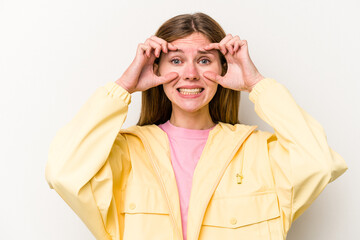 Young English woman isolated on white background keeping eyes opened to find a success opportunity.