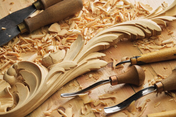 Woodworking tools. Carving wood with chisel. Carpenter's hands use chiesel