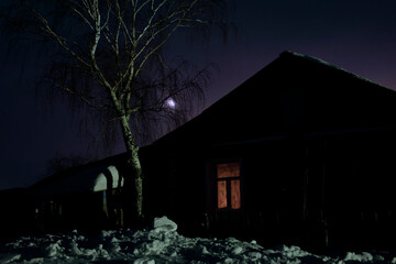 an old house in a private village building in ukraine, against the backdrop of a calm, quiet sky...