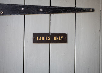 Ladies Only sign old metal plate on door no men women only.