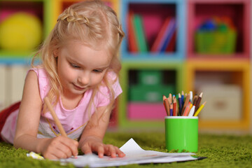  cute little  girl drawing at home