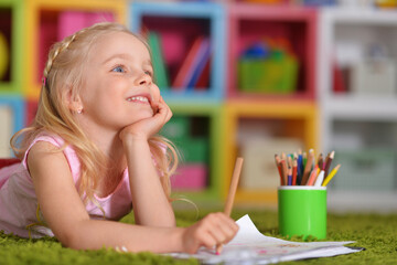  cute little  girl drawing at home