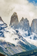 Torres del Paine peaks coming from clouds