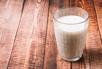 Fresh milk on a wooden background, breakfast, stock photo.