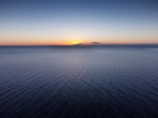 Obraz premium sunrise over the sea on a calm relaxing morning in spain