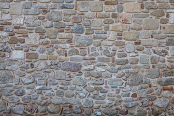 The texture of the stone wall. Background texture of the stone wall of the old castle.